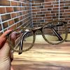 Dark brown frame gold diamond